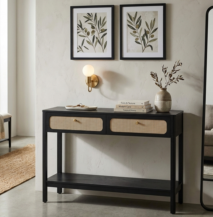 Console table with decor items in a living room setting
