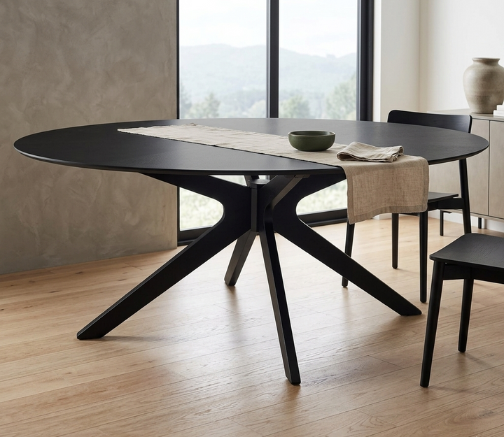 Modern black dining table with chairs in a bright room