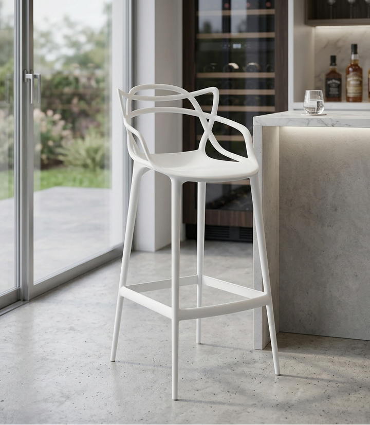 White bar stool in a modern kitchen setting with a view of the outdoors.